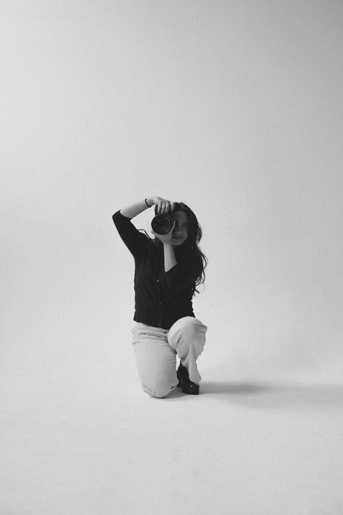 A studio portrait in black and white